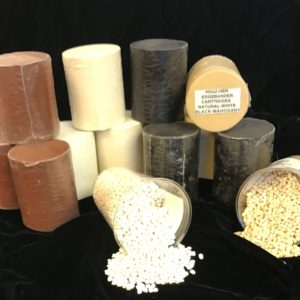 Photo of Hot-Melt Adhesives in varied colors. Some containers have been opened to show their contents.